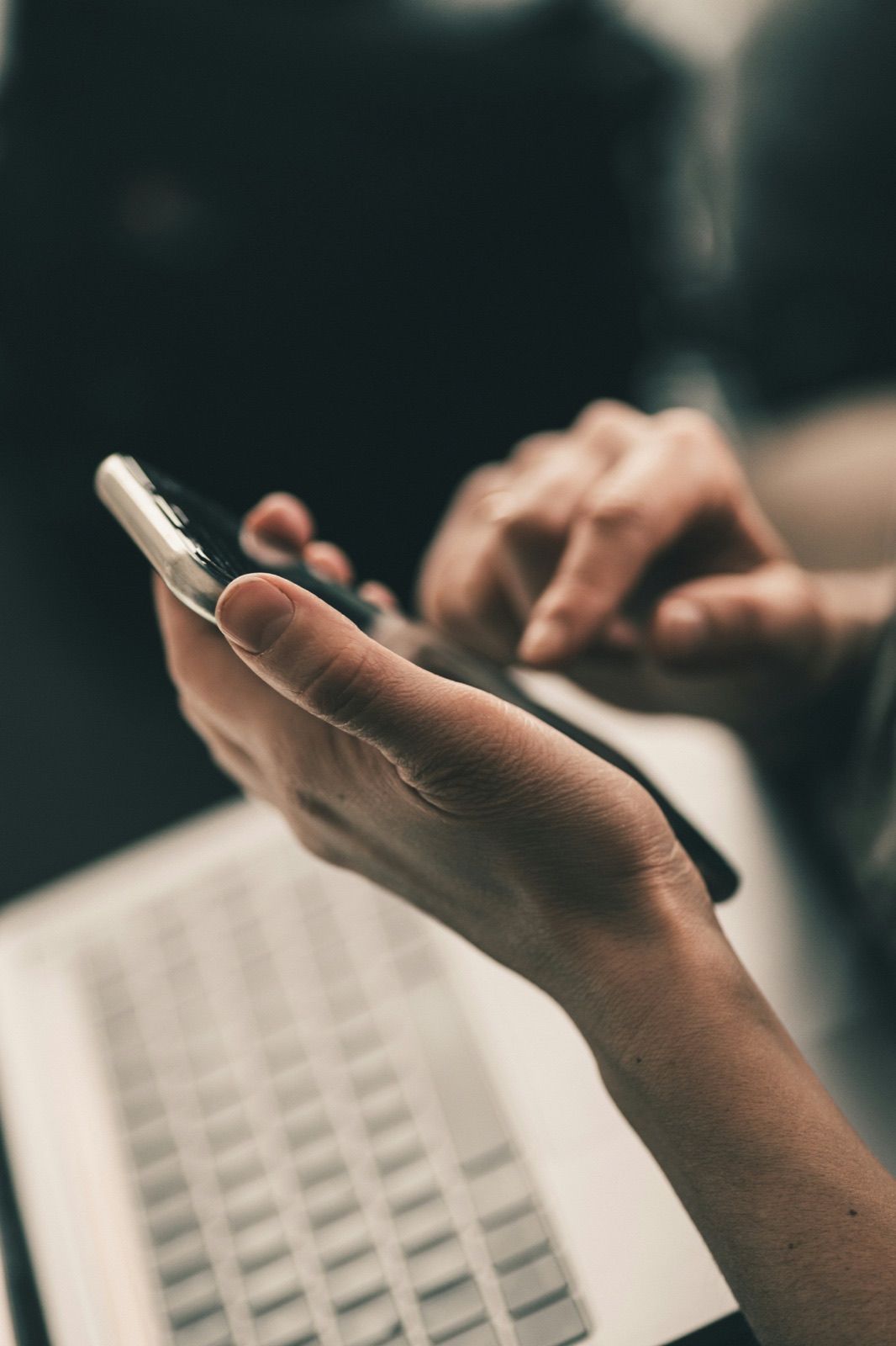 Someone giving to a nonprofit on their phone